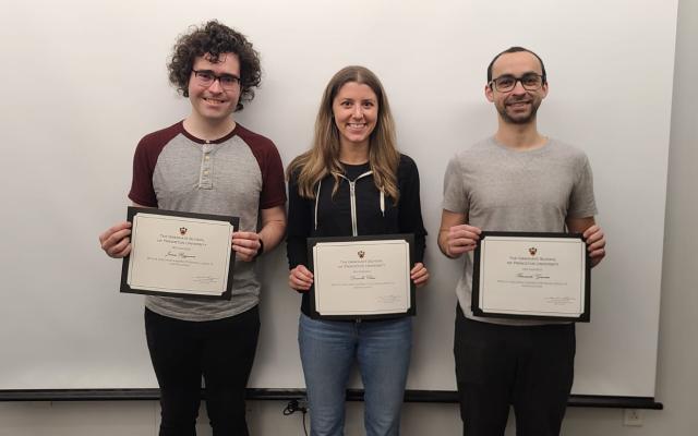 Three smiling graduate students holding teaching award certificates