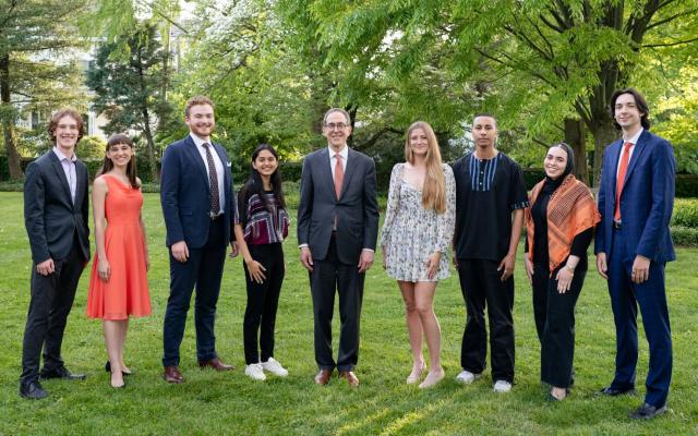The 2024 Spirit of Princeton winners stand with President Christopher L. Eisgruber (center). The seniors are from left to right: Austen Mazenko, Madeleine LeBeau, Stephen Daniels, Archika Dogra, Hailey Mead, Max Diallo Jakobsen, Aisha Chebbi and Joshua Coan. 