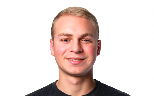 Man with blonde hair in black t-shirt 