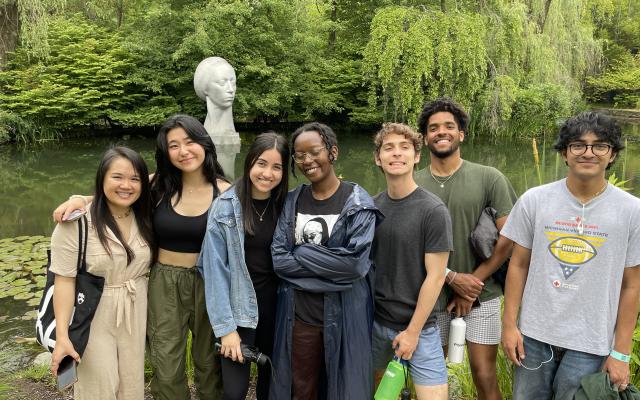 Students standing together in a sculpture garden