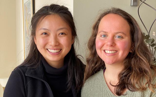 Catherine Wang and Madeleine Cheyette holding a loaf of bread