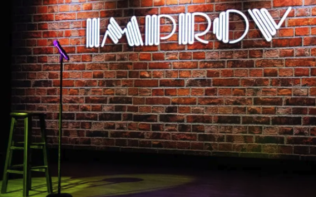 Brick wall with the word IMPROV 