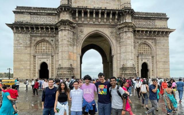 Students posing in front of the Gateway of India monument in Mumbai
