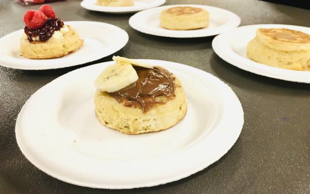 Crumpets on plates with different toppings