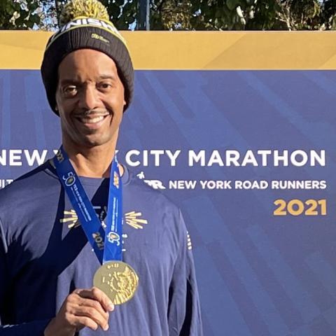 John Weaver with a medal at the New York City marathon